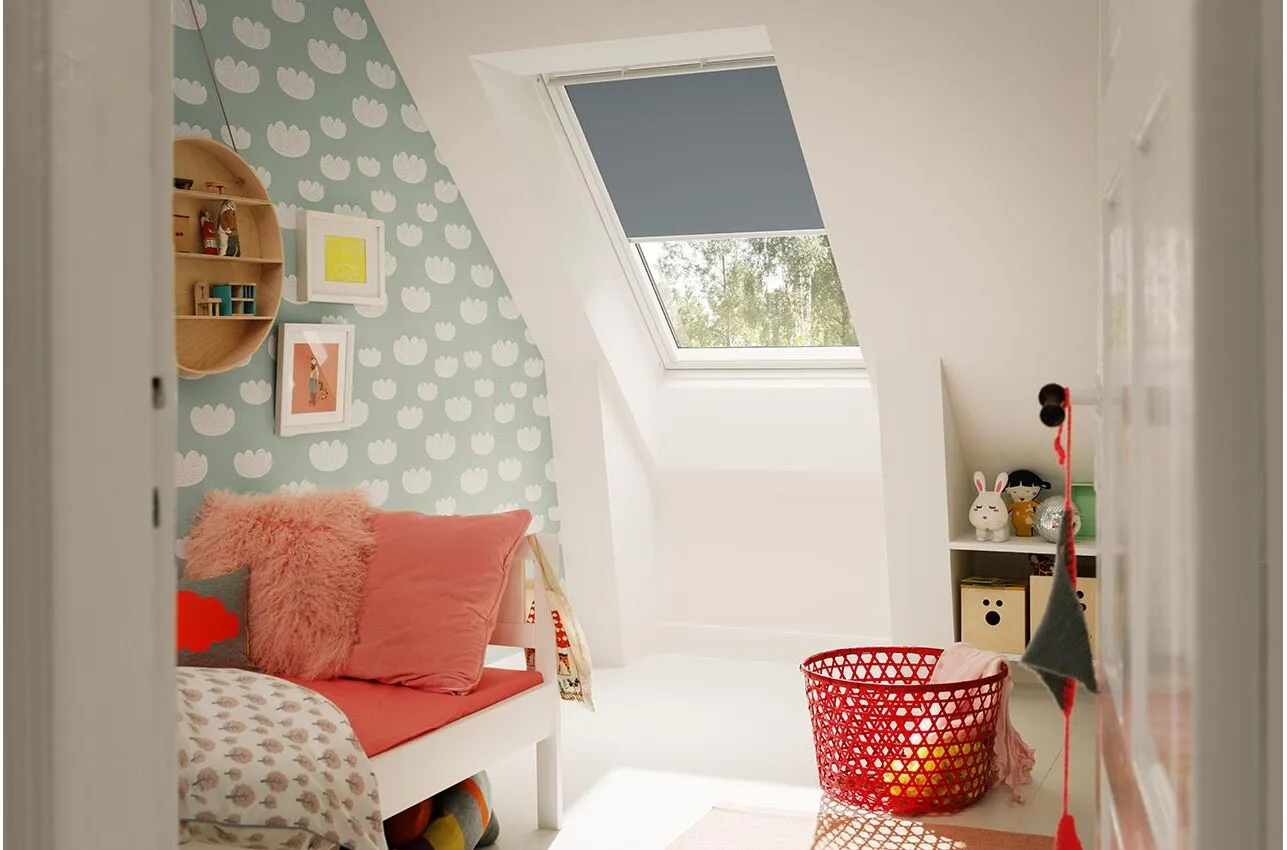 Solar powered Velux blind charged by a panel on the roof window