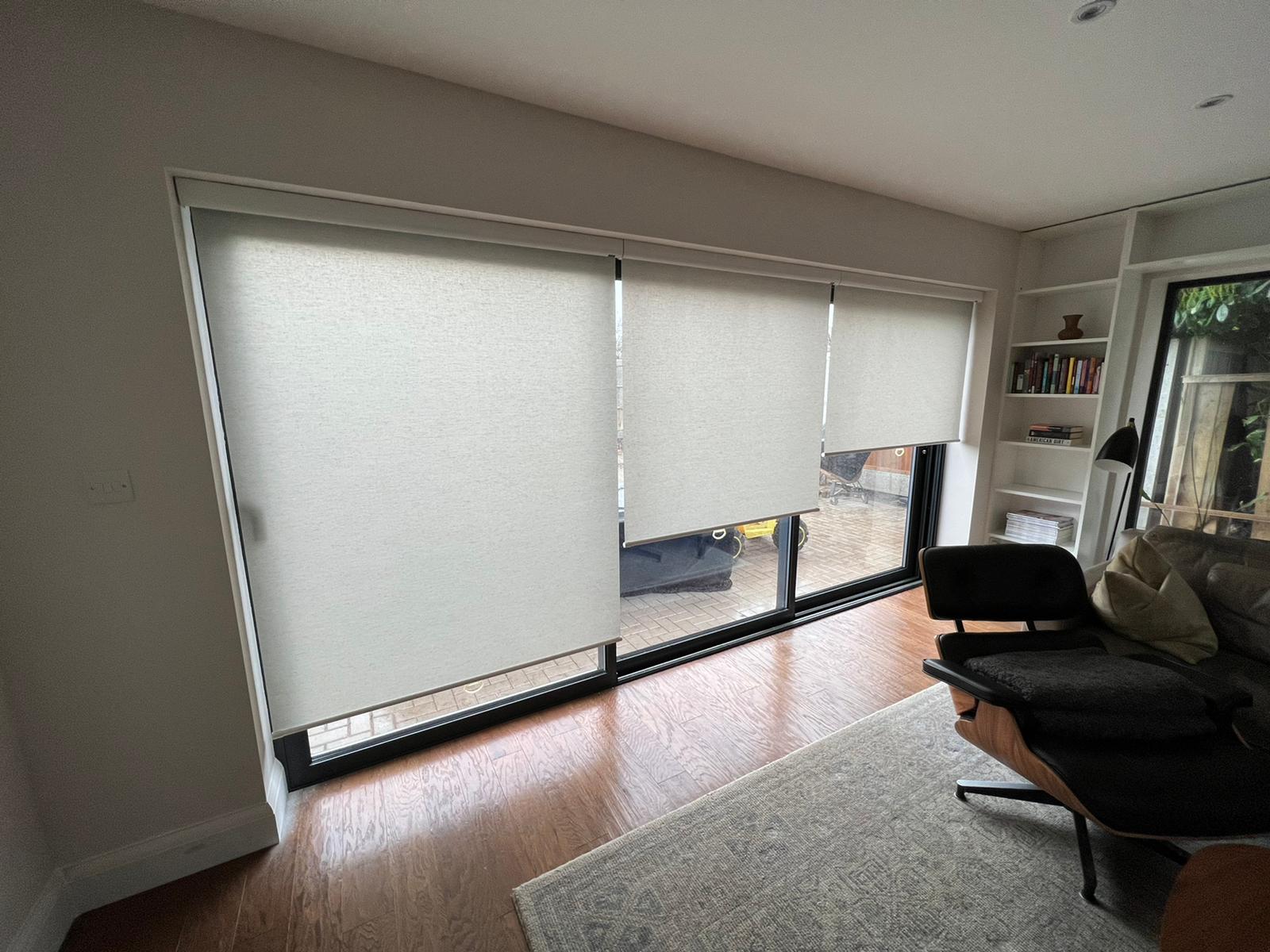 How Roller Blinds Work: spring roller blinds fitted to a window, showing how do roller blinds work without a chain